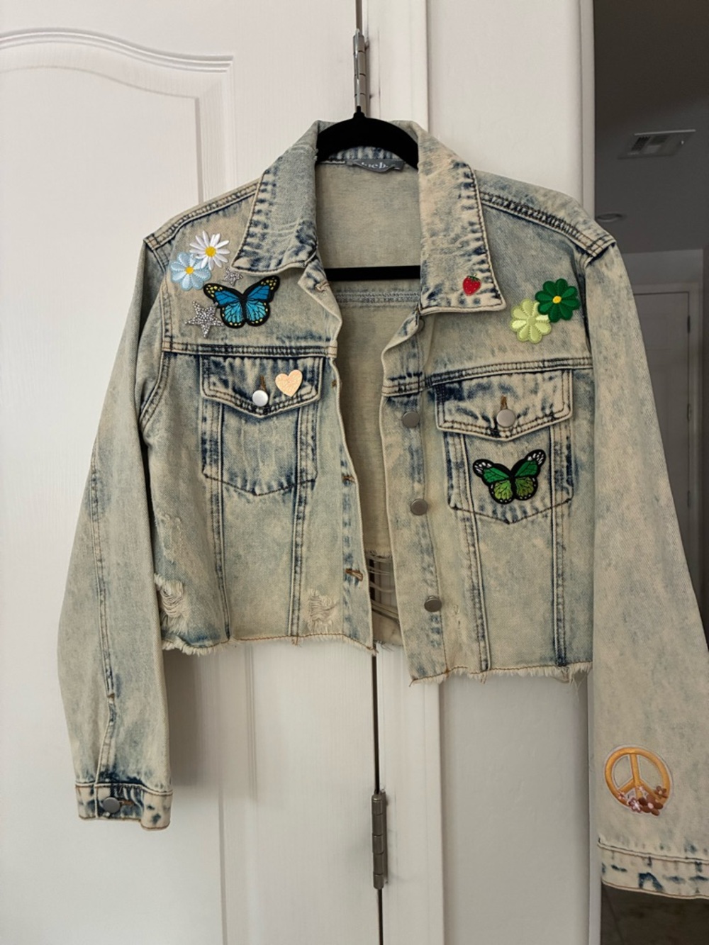 Vintage-Inspired Light Wash Jean Jacket with Embroidered Patches